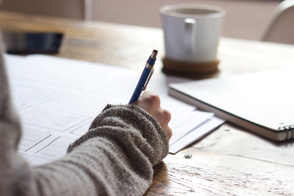 A woman working on sketches